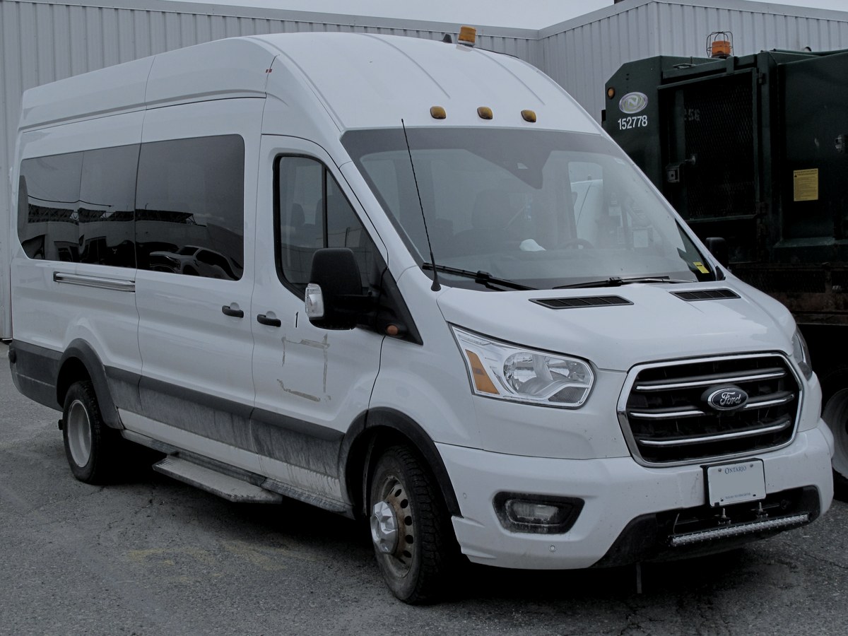 2024 Ford Transit in black — Executive Vans chauffeur vehicle seating 12 passengers
